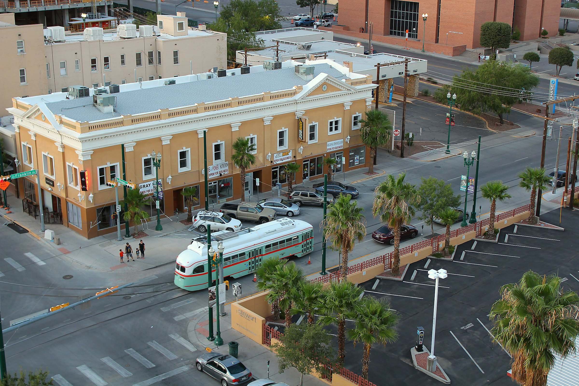 A streetcar at an intersection in downtown El Paso, seen from above