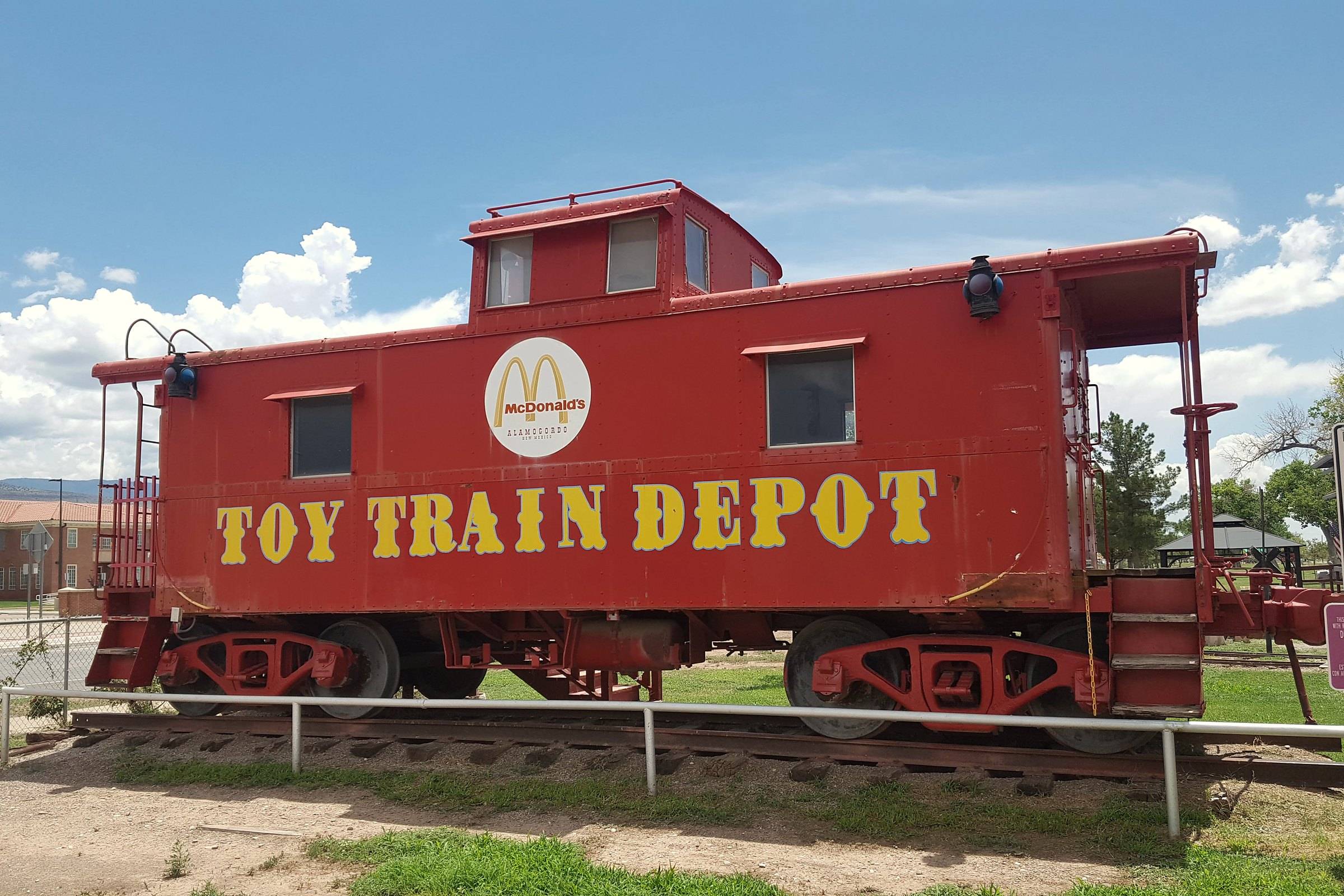 A red caboose on display at the Toy Train Depot in Alamogordo, New Mexico