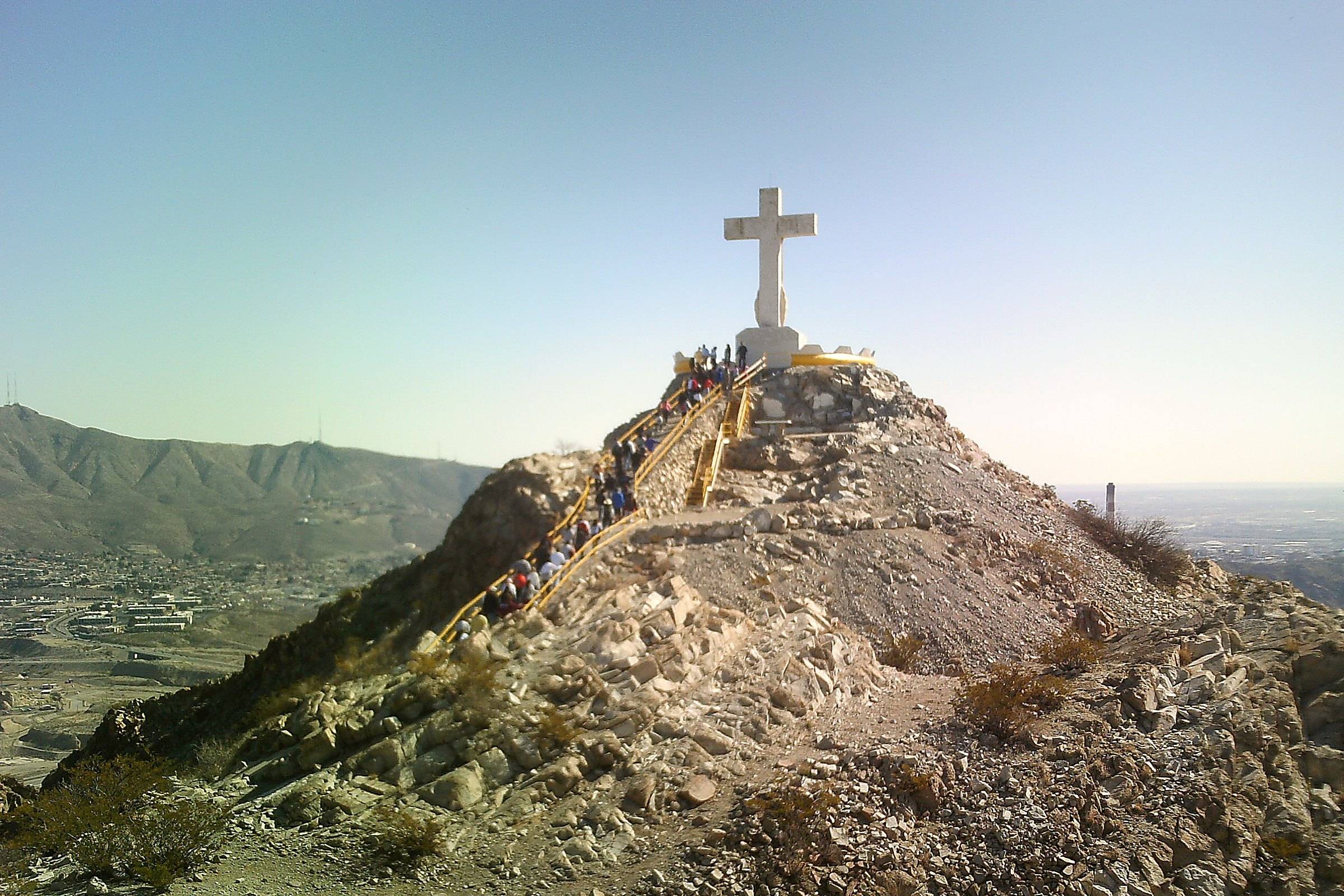 The back of the cross at the top of Mount Cristo Rey in Sunland Park, the desert valley below