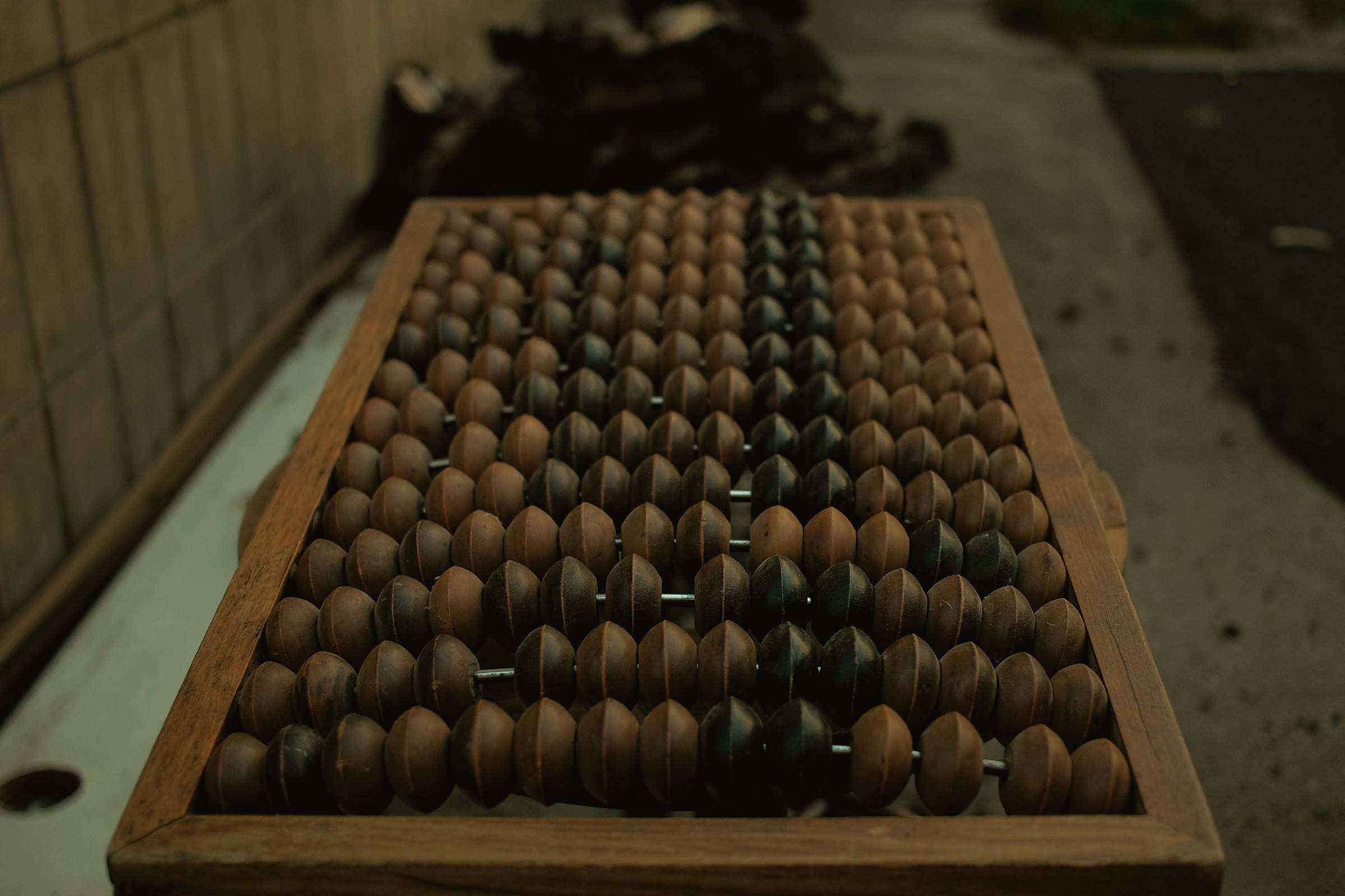 An old wooden abacus with rows of dark beads