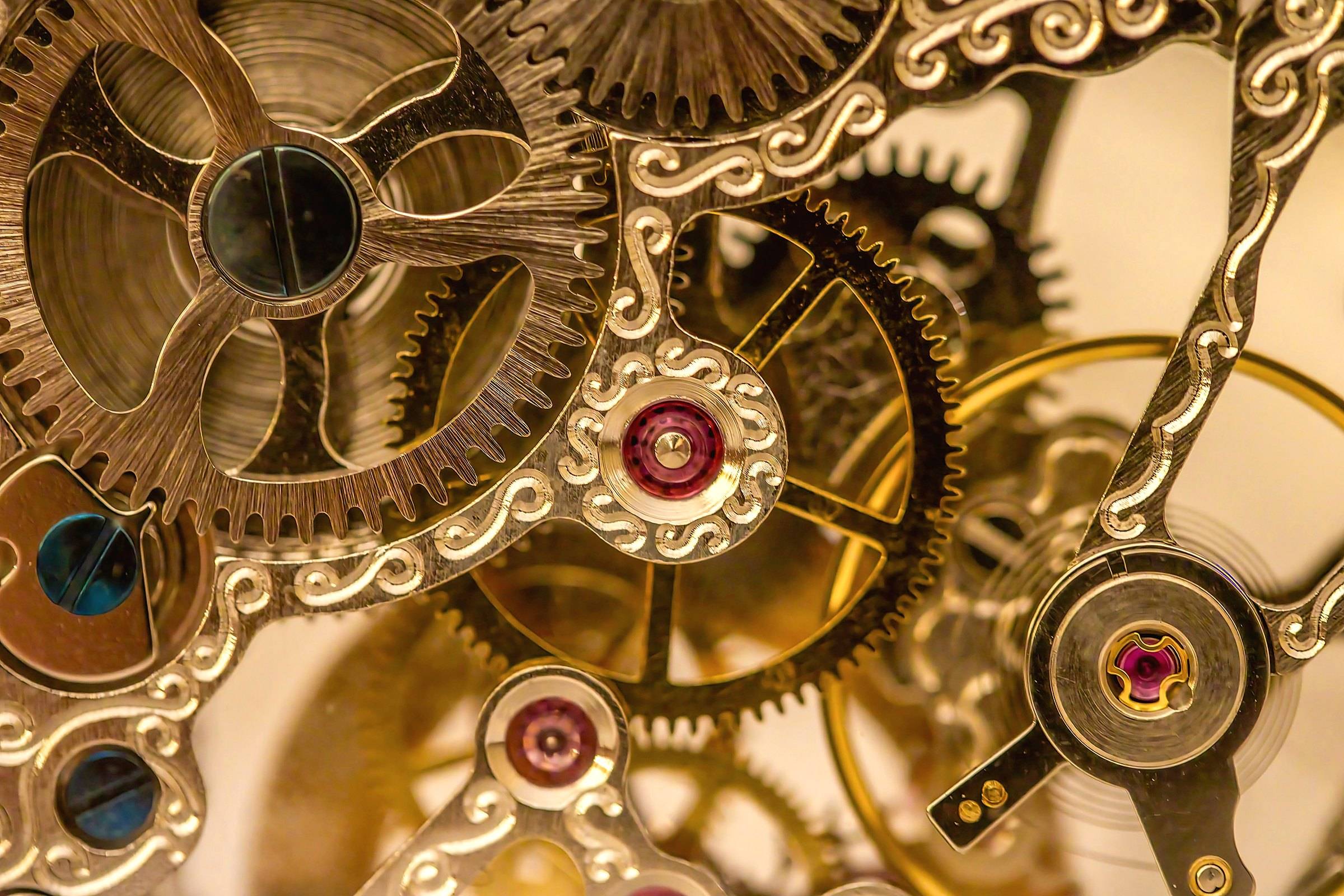 Close-up of the brass gears and wheels of a clock movement